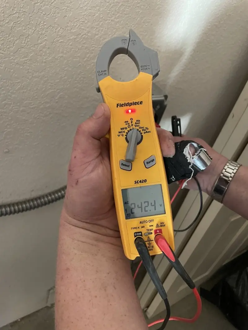 Voltage testing with clamp meter during Outlet Installation in Zionsville